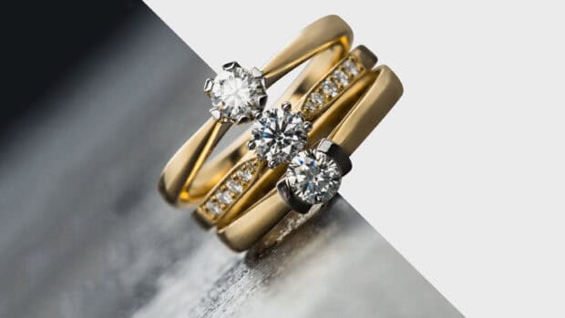 A close up of gold rings adorned with sparkling diamonds in a stylish arrangement, HD Desktop Wallpaper