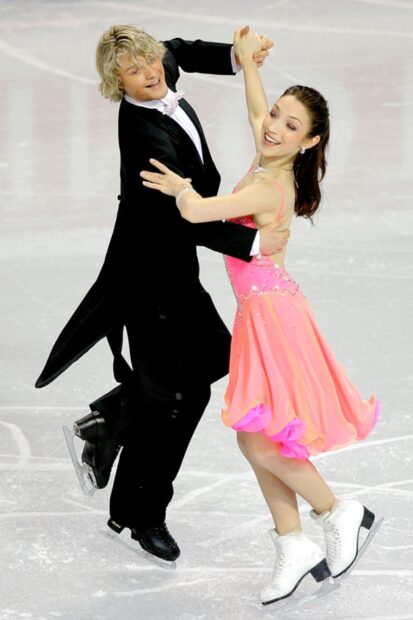 A male and female ice dancing couple gracefully skating on an ice rink during a competition, HD Desktop Wallpaper