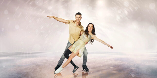 A couple performs an elegant ice dancing routine on a sparkling rink, 2K Desktop Wallpaper