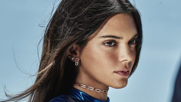 A woman wearing elegant jewelry including earrings and a necklace against blue sky, 4K Desktop Wallpaper