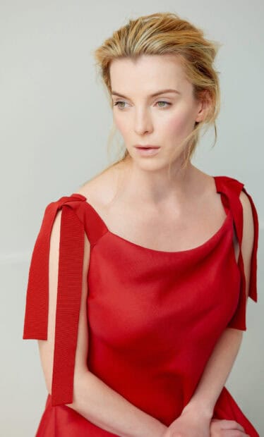 Betty Gilpin wallpapers show her in a striking red dress with a thoughtful expression, HD Phone Wallpaper