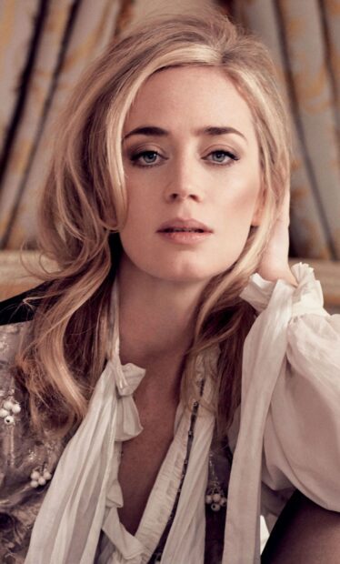 A close up of Emily Blunt wearing a ruffled blouse with soft lighting, HD Phone Wallpaper