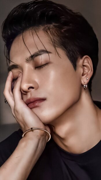 A close up of Jackson Wang with closed eyes and hand on face showing calm expression, HD Mobile Wallpaper