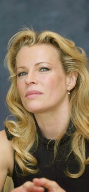 A close up view of Kim Basinger showing her expressive eyes and blonde hair, 2K Mobile Wallpaper
