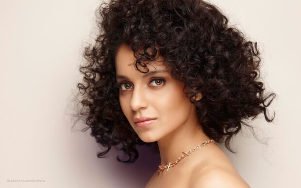 A close up portrait of an elegant woman with curly hair showcasing Bollywood Wallpapers, 2K Desktop Wallpaper