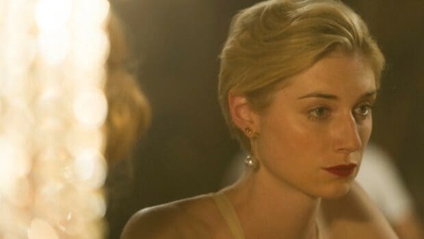 Elizabeth Debicki wallpapers shows a thoughtful woman with short blonde hair and pearl earrings, HD Desktop Wallpaper