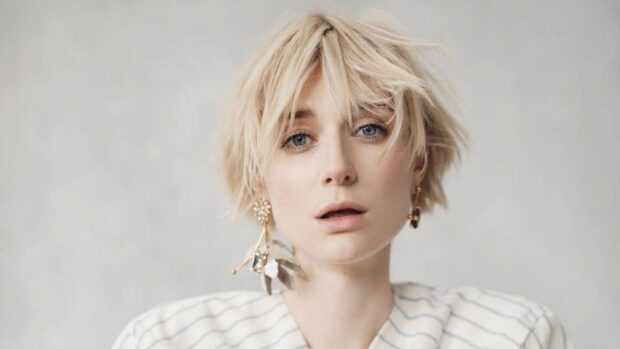 A close up portrait of Elizabeth Debicki with short blonde hair and unique earrings, HD Desktop Wallpaper
