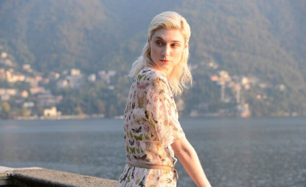 Elizabeth Debicki wears a butterfly print dress by the lakeside during sunset, HD Desktop Wallpaper