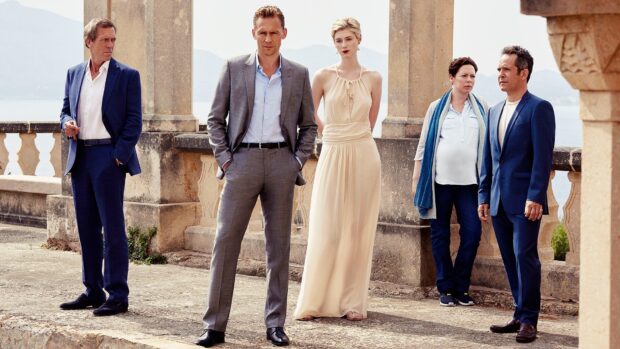 Elizabeth Debicki stands with four other people at a stone terrace overlooking mountains, HD Desktop Wallpaper