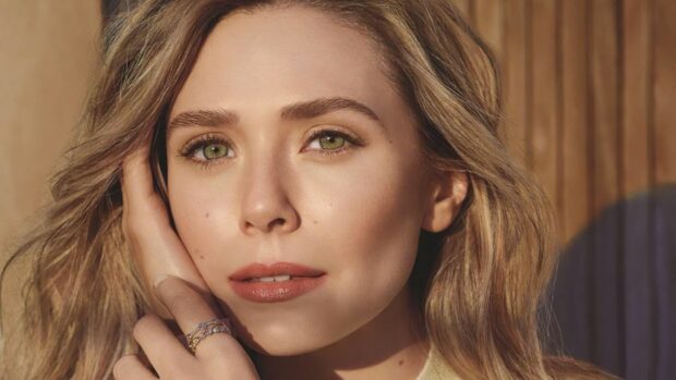 Elizabeth Olsen wallpapers showing a close up of her face with natural makeup and hand near hair, 4K Desktop Wallpaper
