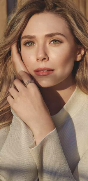 Elizabeth Olsen gazes softly at the camera with a thoughtful expression, 2K Phone Wallpaper