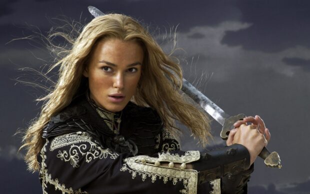 Elizabeth Swann holds a sword ready to strike under a stormy sky, HD Desktop Wallpaper