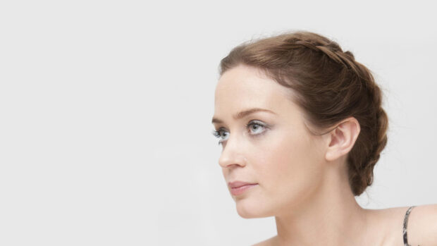 Emily Blunt looks thoughtful with braided hair in a light setting, HD Desktop Wallpaper