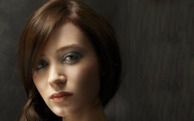 A close up portrait shows Emily Blunt with neutral expression and soft lighting, HD Desktop Wallpaper