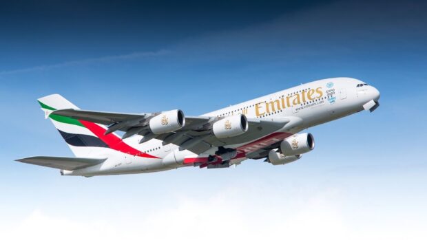 An Emirates Airbus A380 aircraft is flying against a clear blue sky, HD Desktop Wallpaper