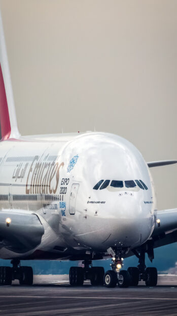 An Emirates Airbus A380 airplane is taxiing on the runway during takeoff, HD Phone Wallpaper