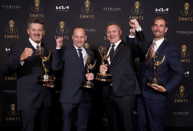 Four men hold Emmy Awards trophies happily posing, 2K Desktop Wallpaper