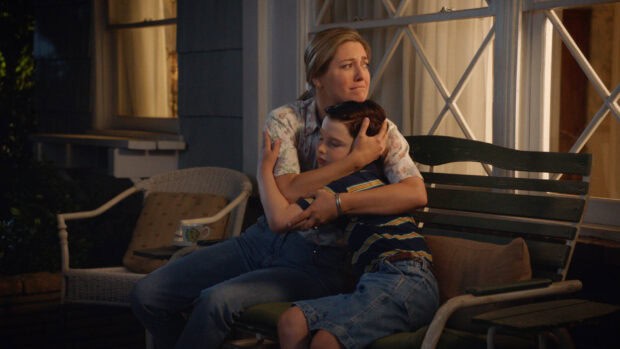 A woman comforts a young boy on a porch at night in Young Sheldon TV series, HD Desktop Wallpaper