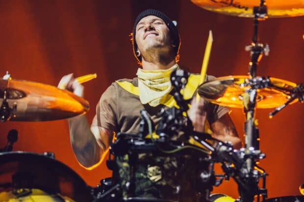Josh Dun wallpapers showing him playing drums with passion on stage, HD Desktop Wallpaper