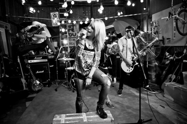 The Paramore band passionately plays music in a lively studio setting, HD Desktop Wallpaper
