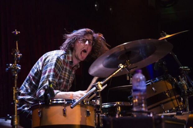 A drummer from Vundabar Band passionately plays drums during a concert performance, HD Desktop Wallpaper