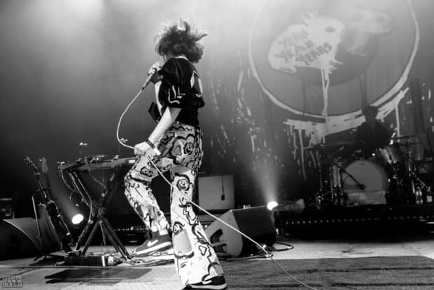 The lead singer is performing on stage during a Yeah Yeah Yeahs concert, HD Desktop Wallpaper