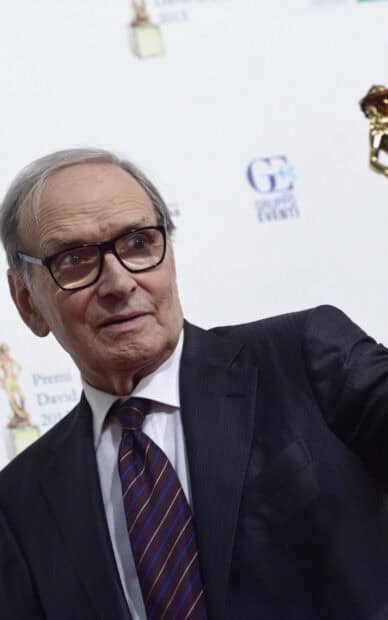 Ennio Morricone wallpapers feature a close up of the composer in a black suit and striped tie, HD Phone Wallpaper