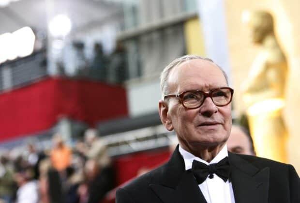 Ennio Morricone is attending a formal event wearing a tuxedo and glasses, HD Desktop Wallpaper