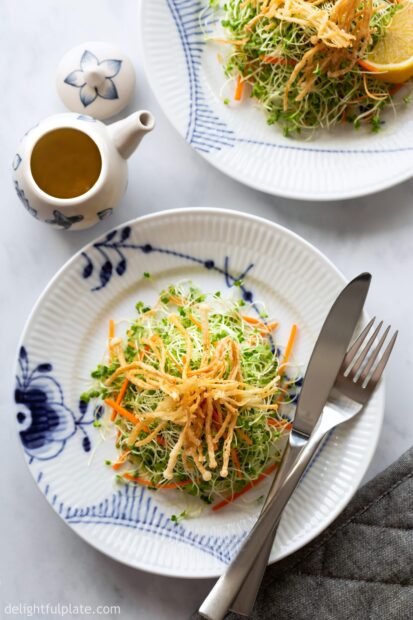 A plate of fresh enoki mushrooms salad served with cutlery on a table, 2K Mobile Wallpaper