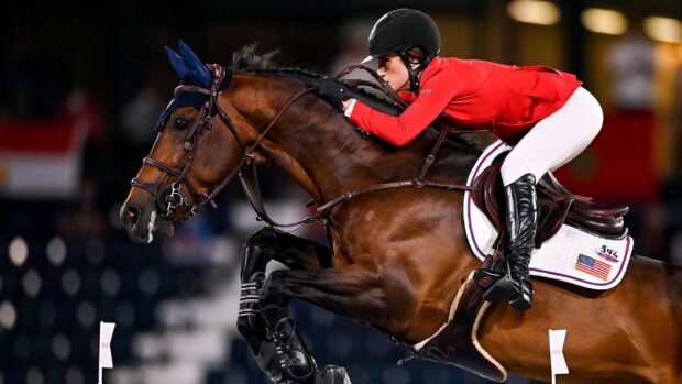 A rider in red is skillfully competing in eventing wallpapers, 2K Desktop Wallpaper
