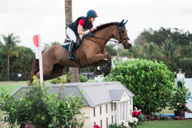 A rider is jumping over a building shaped obstacle with a horse at an eventing competition, HD Desktop Wallpaper