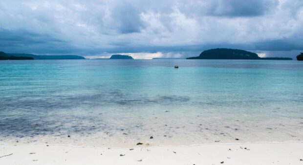 The calm blue sea with distant islands at Espiritu Santo Vanuatu creates a peaceful scene, HD Desktop Wallpaper