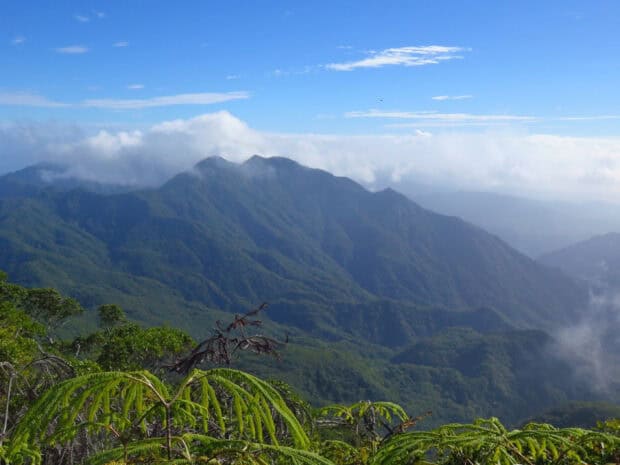 A scenic view of Espiritu Santo Vanuatu with mountains and clouds, 2K Desktop Wallpaper