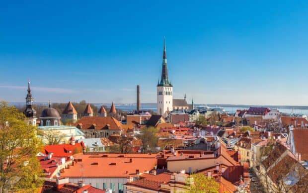 A bright day view of Estonia cityscape featuring historic buildings with a clear blue sky, HD Desktop Wallpaper