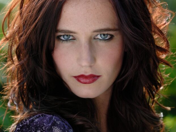 Eva Green has an intense gaze with striking blue eyes and red lipstick in this close up portrait, HD Desktop Wallpaper