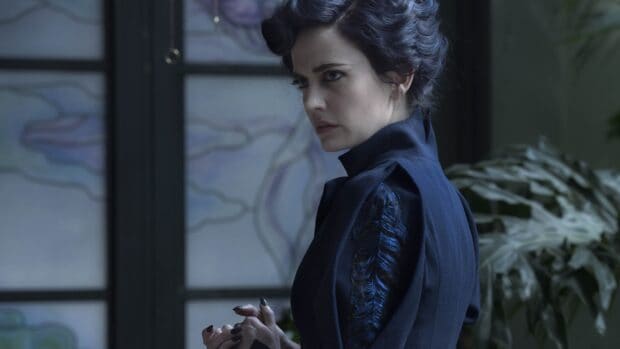 Eva Green has an intense gaze wearing a dark detailed outfit indoors, 4K Desktop Wallpaper