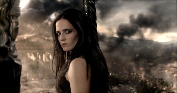 Eva Green stands with a serious expression against a smoky battlefield, HD Desktop Wallpaper