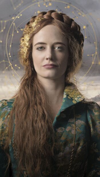 Eva Green is shown wearing a green floral coat with long hair and a golden celestial design, 2K Phone Wallpaper