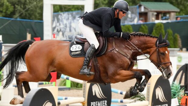 A rider in full gear competes in eventing wallpapers HD during a jumping event, HD Desktop Wallpaper