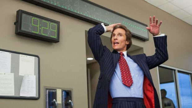 A man in a pinstripe suit raising his hands in an office setting with a digital clock showing 8 29, HD Desktop Wallpaper