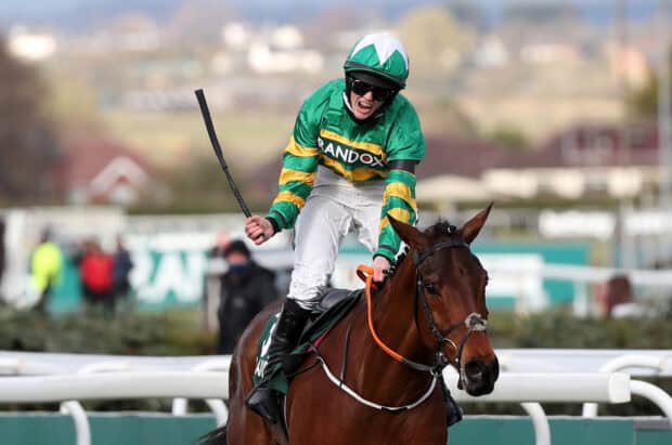 A jockey in green and yellow silks rides a horse during a horse racing event, HD Desktop Wallpaper