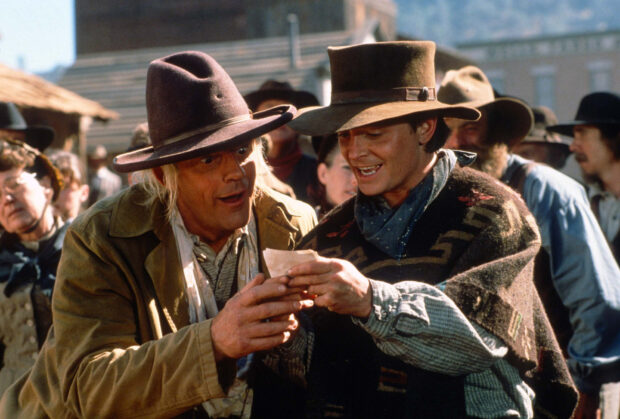 Two cowboys reading a letter in a western town scene featuring Robert Zemeckis wallpaper, HD Desktop Wallpaper