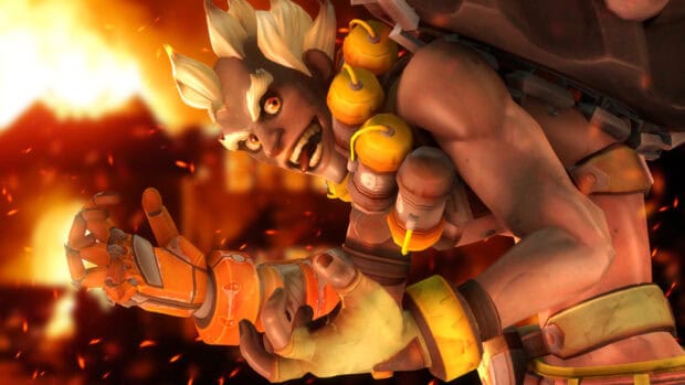 Junkrat character with wild hair and grenades prepares for battle in fiery background, HD Desktop Wallpaper