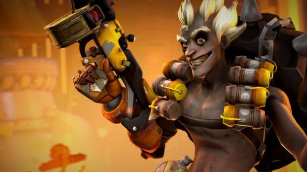 The character Junkrat is holding a weapon and wearing explosives strapped to his chest, HD Desktop Wallpaper