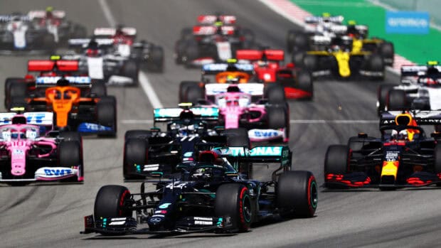 A close up of F1 race cars competing intensely on the race track, HD Desktop Wallpaper