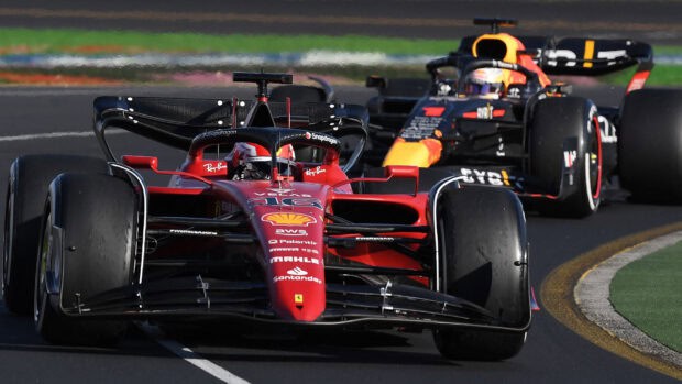 Two F1 race cars are driving closely on a curved circuit during a race, HD Desktop Wallpaper