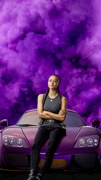 A confident woman stands in front of a purple sports car with purple smoke behind her in this F9 Wallpapers, 4K Mobile Wallpaper