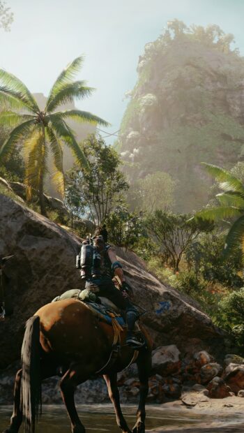 A rider on a horse explores the lush jungle terrain in Far Cry 6, HD Phone Wallpaper