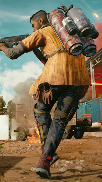 A soldier from Far Cry 6 runs through a battle zone with a weapon and fuel tanks on his back, 4K Phone Wallpaper