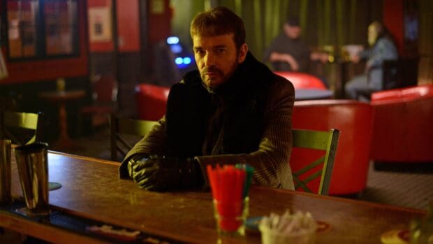 A serious man sits alone at a bar in a dark lounge from Fargo Wallpapers, 4K Desktop Wallpaper